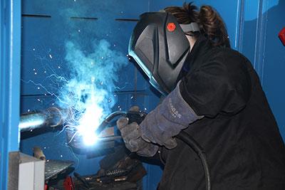 Student welding in the welding lab
